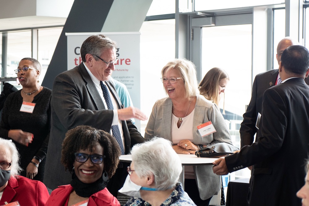 UC's Anastasios Angelopoulos and Jane Combs have a laugh before the start of the R+I Week awards ceremony. 